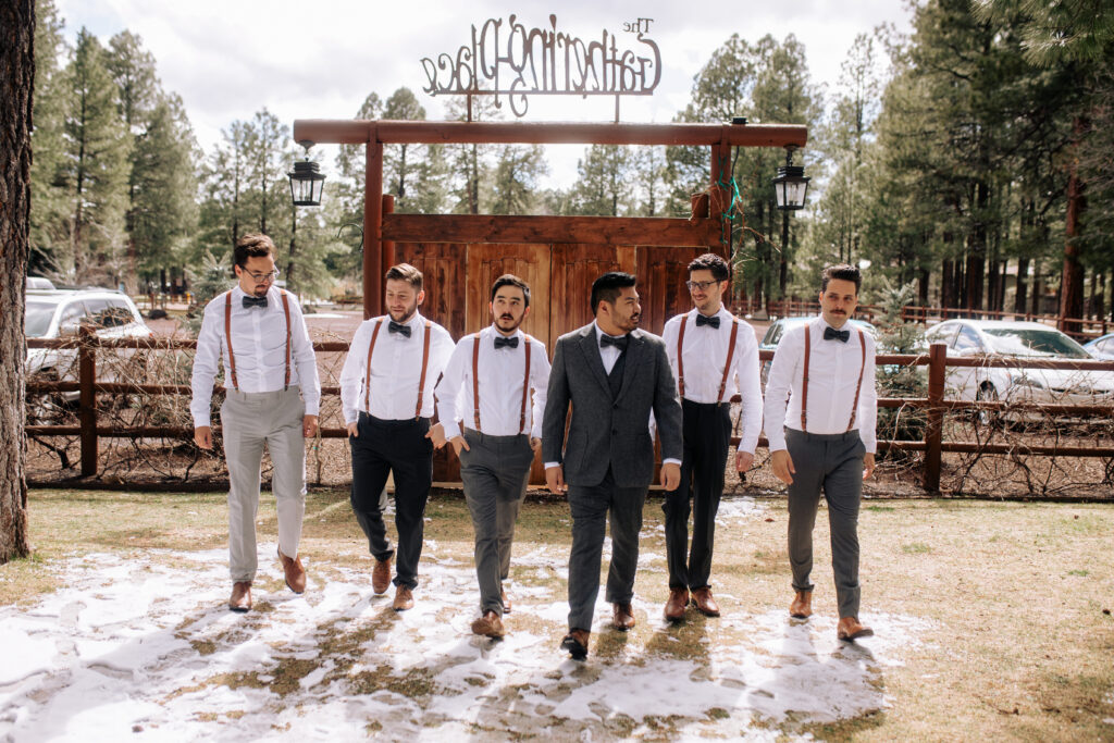 Groom and groomsmen in rustic wedding attire